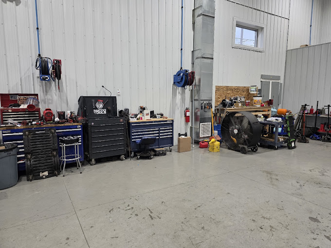Inside SH OH Truck Repair workshop showing professional service bays and tools