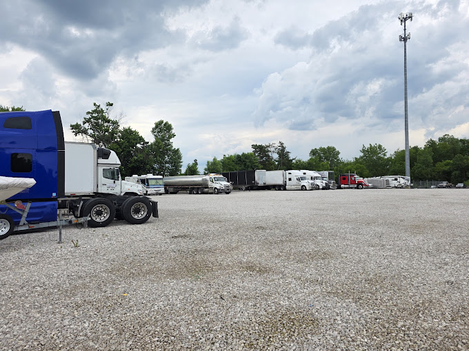 SH OH Truck Repair parking lot with multiple commercial trucks and trailers